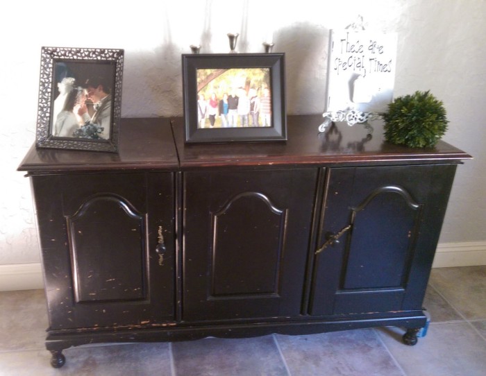 Before: Black stereo cabinet